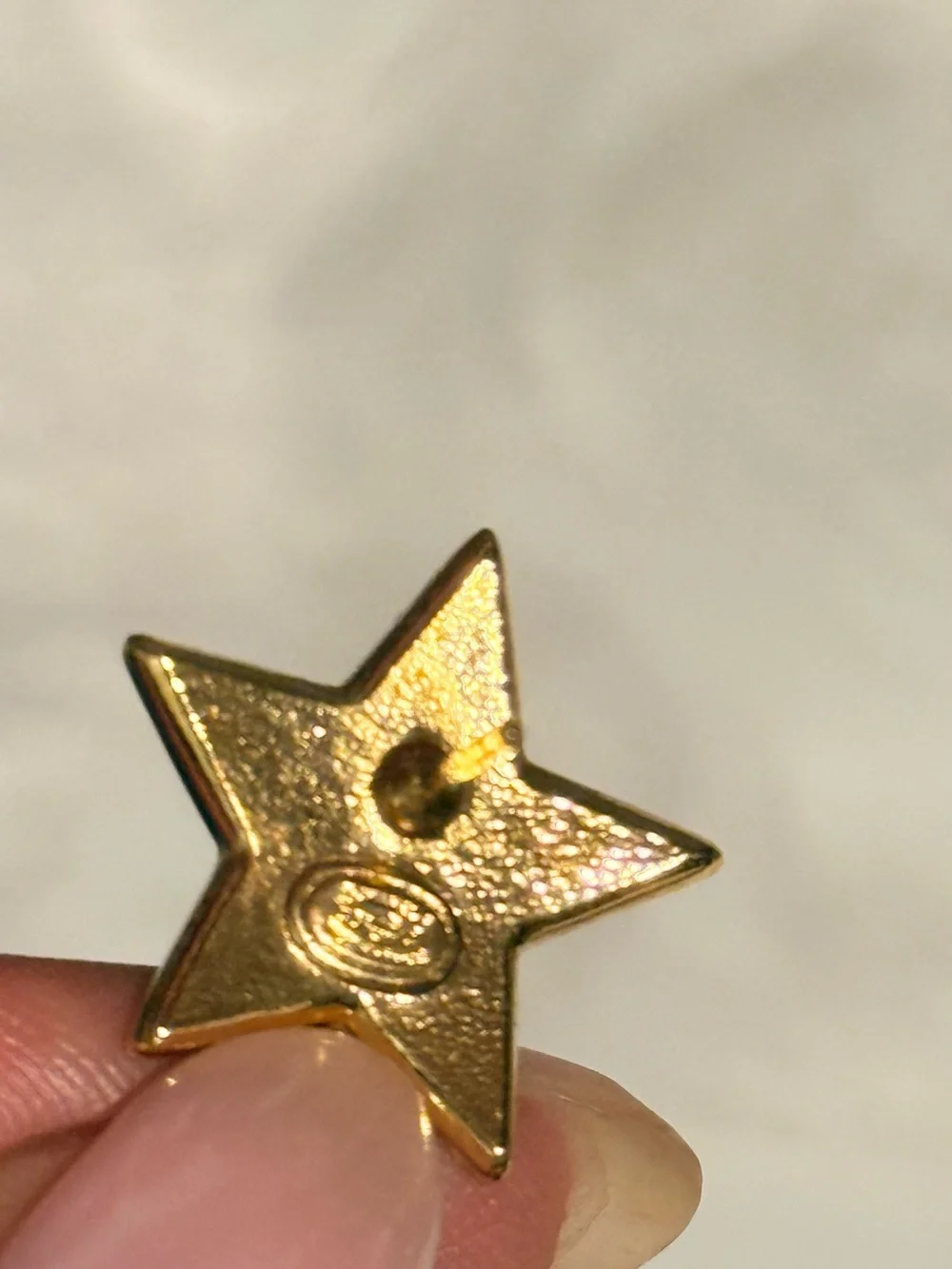 CHANEL Gold Star Drop Earrings with Black Enamel